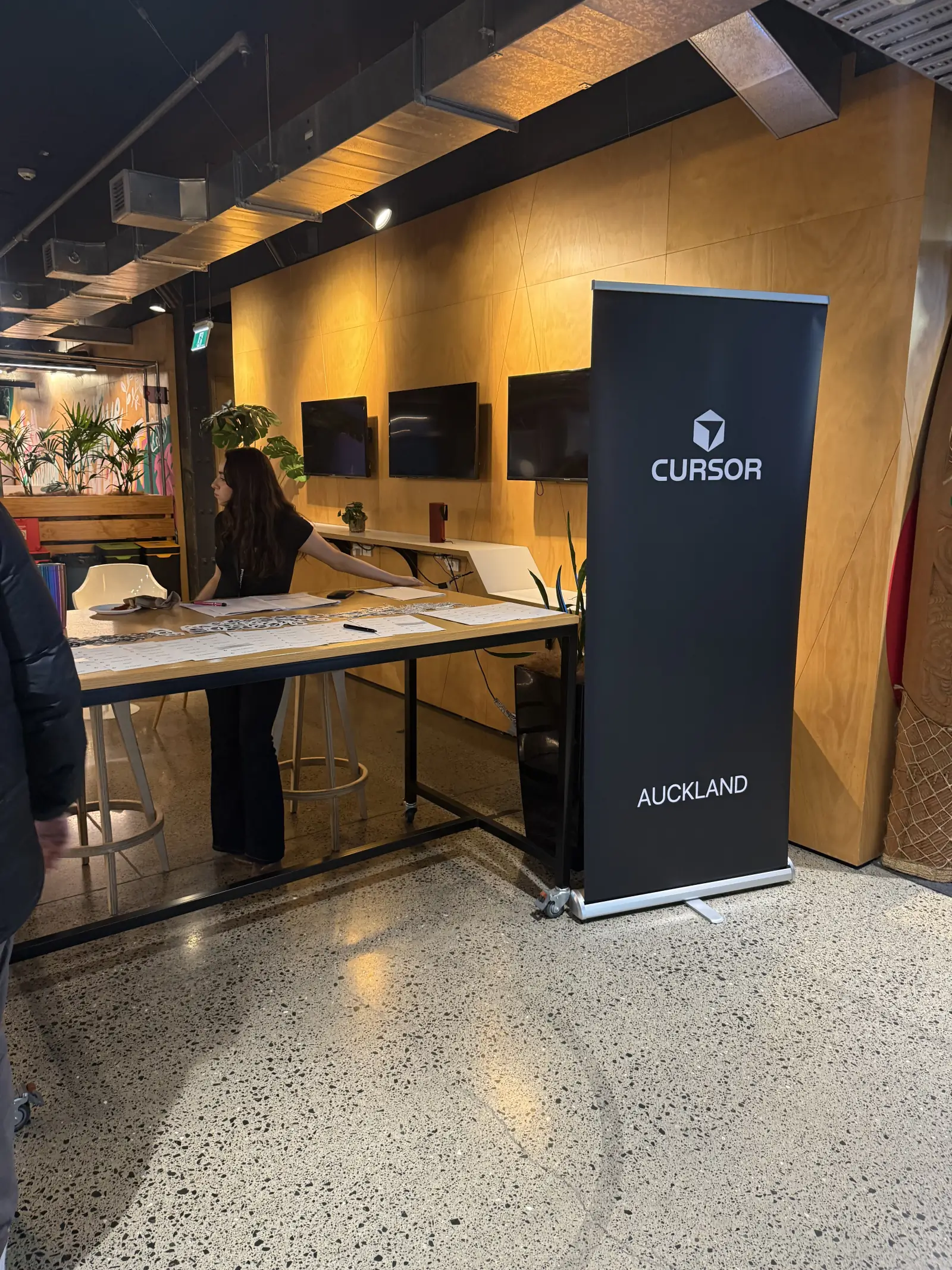Registration desk with Cursor Auckland banner at GridAKL