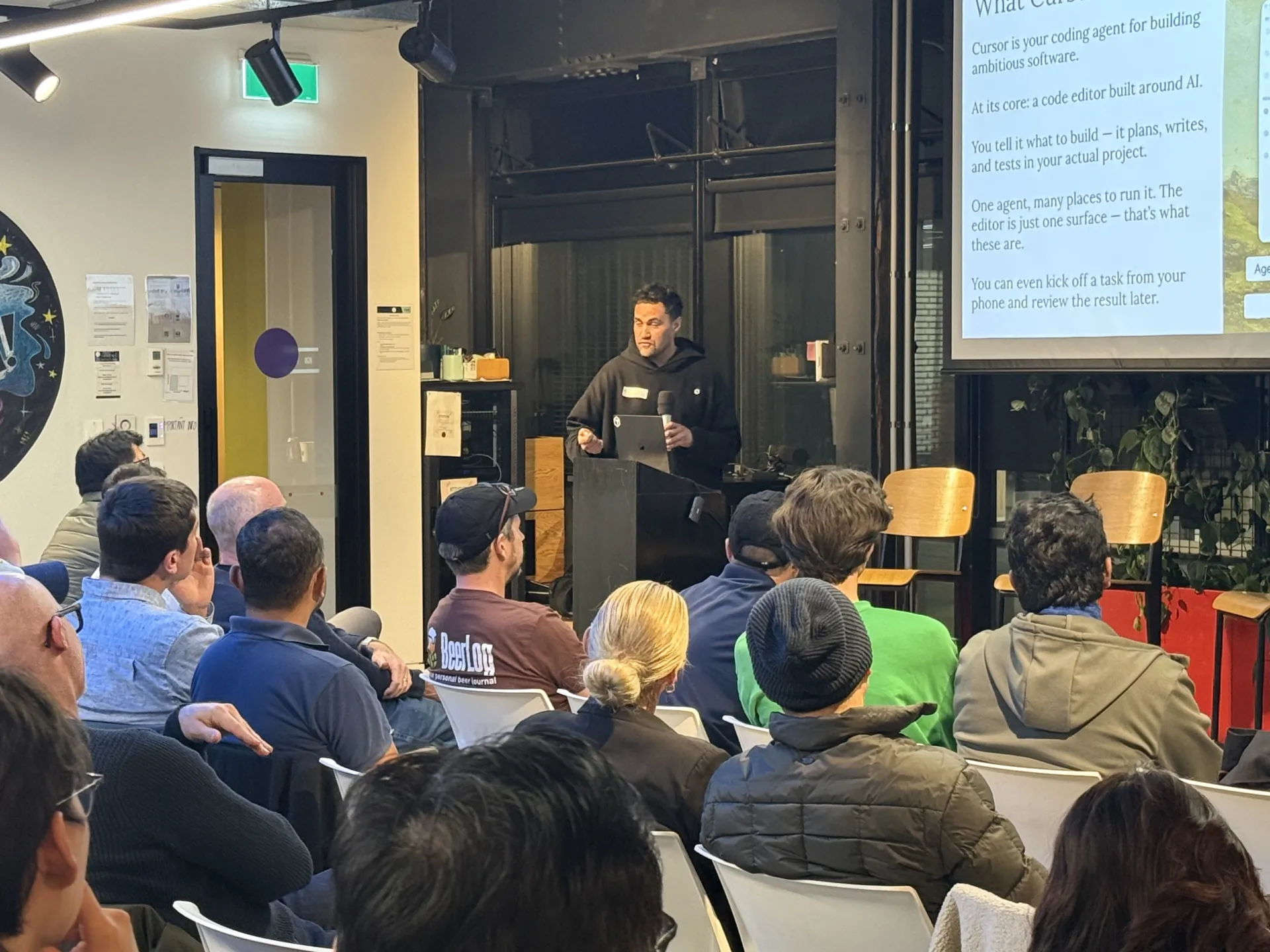 Presenter explaining what Cursor is to the Auckland audience